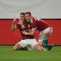 Hungary's forward Roland Sallai (L) celebrates scoring with his teammate, forward Laszlo Kleinheisler (R), during the Nations League football match between Hungary and Greece on September 11, 2018, in Budapest, Hungary. (Photo by ATTILA KISBENEDEK / AFP)
