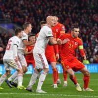 Wales' forward Gareth Bale (R) keeps hisa eye on the ball during the Group E Euro 2020 football qualification match between Wales and HUngary at Cardiff City Stadium in Cardiff, Wales on November 19, 2019. (Photo by Paul ELLIS / AFP)