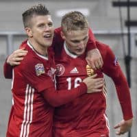 Hungary's midfielder Kevin Varga (R) celebrates scoring his team's second goal with Hungary's midfielder David Siger (L) who had scored his team's first goal, during the UEFA Nations League Group B football match Hungary v Turkey at the Puskas Arena in Budapest, Hungary, on November 18, 2020. - Hungary won 2-0. (Photo by ATTILA KISBENEDEK / AFP)