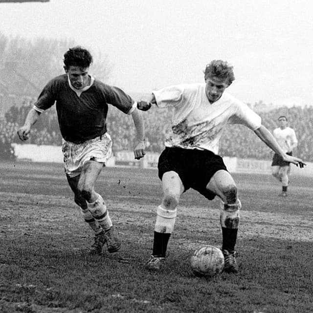 Huddersfield Town's Denis Law (r) shields the ball from Leyton Orient's Denis Sorrell (l)  (Photo by S&amp;G/PA Images via Getty Images)