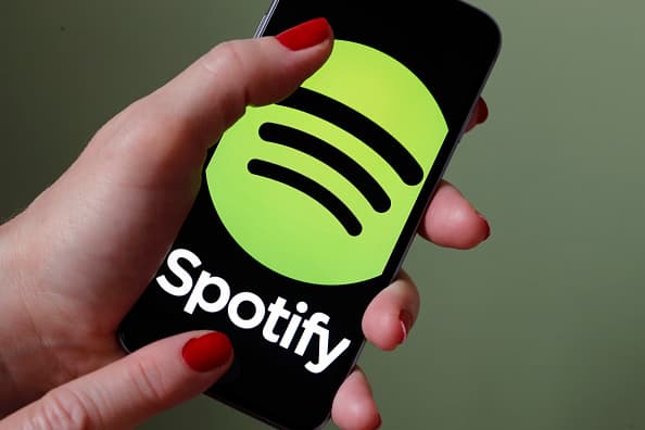 PARIS, FRANCE - JANUARY 06:  In this photo illustration, the logo of the Swedish music streaming service Spotify is displayed on the screen of an iPhone on January 06, 2017 in Paris, France. Spotify announced, via a tweet published Thursday, that it now has 70 million paid subscribers. As a comparison, in September, Apple Music claimed 30 million subscribers and Deezer had fewer than 10 million subscribers. Spotify, the world's largest streaming music company, is expected to be listed on the Wall Street stock market in the first quarter of 2018.  (Photo by Chesnot/Getty Images)