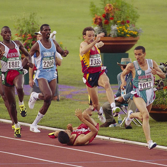 ATLANTA - AUGUST 8:  Hicham El Guerrouj of Morocco is tripped over in the 1500m final during the Atlanta Olympic Games 1996 held on August 8, 1996 at the Olympic Stadium, in Atlanta, Georgia, USA. (Photo by Gray Mortimore/Getty Images)