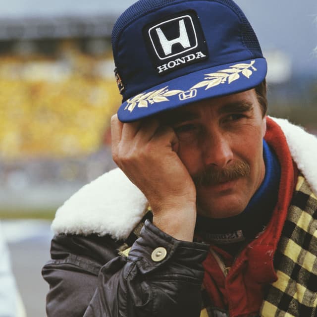 British Formula One racing driver Nigel Mansell, of the Williams-Honda team, in the pit lane before the start of the 1986 Australian Grand Prix at the Adelaide Street Circuit in Adelaide, Australia, 26th October 1986. This Grand Prix was the last of the season and Mansell, in championship-winning position, was forced to retire from the race after a rear tyre blowout on the 64th lap. (Photo by Bryn Colton/Getty Images)