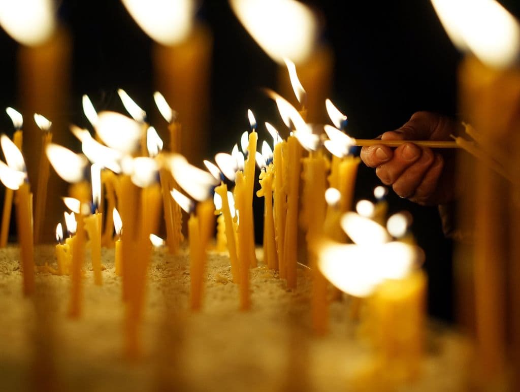 SKOPJE, MACEDONIA - APRIL 8: Orthodox Christians light candles before the celebration of the Orthodox Easter at Marko's Monastery near Skopje, Macedonia on April 8, 2018. The Macedonian Orthodox Church celebrated Easter, according to the Julian calendar.

 (Photo by Stringer/Anadolu Agency/Getty Images)
