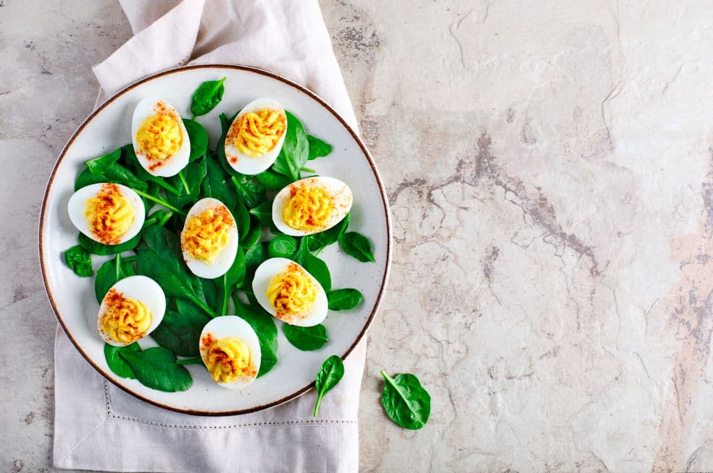 Deviled Eggs with Paprika as an Appetizer, top view. (Photo by: Anjelika Gretskaia/REDA&amp;CO/Universal Images Group via Getty Images)