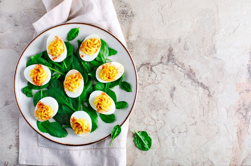 Deviled Eggs with Paprika as an Appetizer, top view. (Photo by: Anjelika Gretskaia/REDA&amp;CO/Universal Images Group via Getty Images)