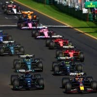 MELBOURNE, AUSTRALIA - APRIL 02: Max Verstappen of the Netherlands driving the (1) Oracle Red Bull Racing RB19 leads George Russell of Great Britain driving the (63) Mercedes AMG Petronas F1 Team W14 and the rest of the field off the line at the start during the F1 Grand Prix of Australia at Albert Park Grand Prix Circuit on April 02, 2023 in Melbourne, Australia. (Photo by Bryn Lennon - Formula 1/Formula 1 via Getty Images)