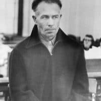 (Original Caption) Edward Gein, 51-year-old farmer, is shown in Wautoma court where he was arraigned on charges of armed robbery Monday after his arrest following discovery of a truck owned by a hardware store which was robbed recently. The truck was found parked beside a shed on Gein's farm. Further search uncovered the body of the store owner, Mrs. Bernie Worden. Since then 10 skulls were found, but today the grisly figure jumped to 15 when remains of more bodies were found after a new search of Gein's dilapidated Wisconsin home, where he has lived for the last 12 years alone.