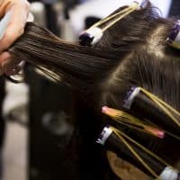 Perm rolling the hair onto curlers