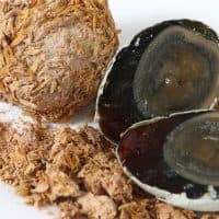 Preserved duck egg on white isolated background