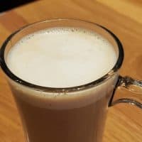 An almond milk latte is visible on a restaurant table, Pleasant Hill, California, November 9, 2021. Photo courtesy Sftm. (Photo by Gado/Getty Images)