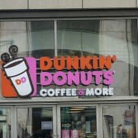 21 March 2022, Berlin: The logo of the US fast-food chain Dunkin' Donuts on a branch at Alexanderplatz. It offers coffee and donuts as its main product. Photo: Alexandra Schuler/dpa (Photo by Alexandra Schuler/picture alliance via Getty Images)