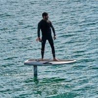 CASCAIS, PORTUGAL - MAY 01: A surfer sails on a Waydoo Flyer ONE electric powered board in the Bay of Cascais on the day it ends the state of emergency during the COVID-19 Coronavirus pandemic on May 01, 2021 in Cascais, Portugal. The country has reverted to state of "calamity", opened its borders with Spain and reestablished among different measures the possibility of practicing outdoors sports. The epidemiological bulletin released today by the Directorate General of Health (DGS) reported 470 new cases of COVID-19 and one more death in the last 24 hours. In total, Portugal register 836,947 infections, 16,976 deaths and 796,477 recoveries. (Photo by Horacio Villalobos#Corbis/Corbis via Getty Images)