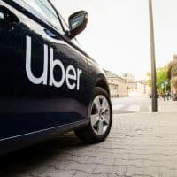 Warsaw, Poland  - April 30, 2019: View on Uber car (Skoda) with inscription on the street before sunset