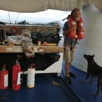 This handout picture released by Grupomar shows Australian sailor Tim Shaddock and his dog "Bella" after being rescued by the crew of a Mexican tuna vessel, part of the Grupomar fleet, in the Pacific Ocean on July 17, 2023. An Australian sailor rescued with his dog after more than two months adrift in the Pacific Ocean arrived in Mexico Tuesday, declaring, "I am so grateful. I'm alive." Tim Shaddock was picked up with his dog "Bella" by a tuna vessel after the pair survived for weeks on raw fish and rainwater on their storm-crippled boat. (Photo by Handout / Grupomar / AFP) / RESTRICTED TO EDITORIAL USE - MANDATORY CREDIT "AFP PHOTO / GRUPOMAR" - NO MARKETING NO ADVERTISING CAMPAIGNS - DISTRIBUTED AS A SERVICE TO CLIENTS