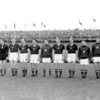 Hungary's national soccer team forms a line for the presentation of the national anthems on 4 July 1954 at Wankdorf Stadium in Bern just prior to the World Cup final match against Germany. The team consists of: (from left to right) Ferenc Puskas, Gyula Grosics, Gyula Lorant, Nandor Hidegkuti, Jozsef Bozsik, Mihaly Lantos, Jozsef Zakarias, Jenö Buzanzski, Jozsef Toth, Sandor Kocsis, Zoltan Czibor. (Photo by dpa/picture alliance via Getty Images)