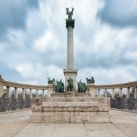 This is Heroes' Square, one of the major squares in Budapest, Hungary, noted for its iconic Millennium Monument with statues. This large square constructed in 1896 for the millennium of the Magyar Conquest of Hungary.