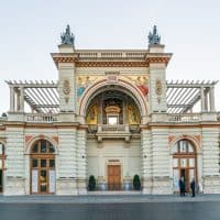 Budapest, Hungary - October 01, 2019: Street view of the Castle Garden Bazaar (Varkert Bazar) designed by Miklos Ybl, with pass byers on the Lanchid street from the North.