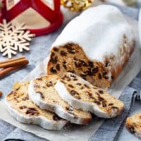Christmas stollen. Traditional German festive dessert. Marble background. Close up.