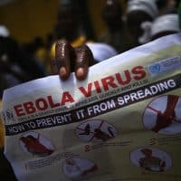 MONROVIA, LIBERIA - AUGUST 18:  Public health advocates stage an Ebola awareness and prevention event on August 18, 2014 in Monrovia, Liberia. The Liberian government and international groups are trying to convince residents of the danger and are urging people to wash their hands to help prevent the spread of the epidemic, which is spread by bodily fluids.  The virus has killed more than 1,000 people in four African countries, and Liberia now has had more deaths than any other country.  (Photo by John Moore/Getty Images)