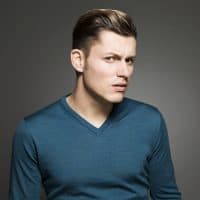 Studio shot of a suspicious young man