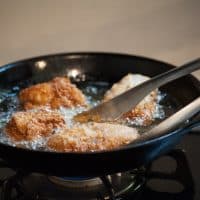 Preparing fried chicken