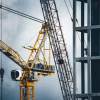 Construction tower cranes on a building site