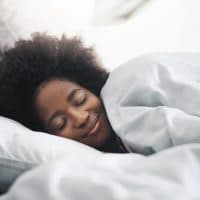 Shot of an attractive young woman sleeping in her bed in the morning at home