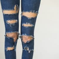 Woman in fashionable ripped Jeans