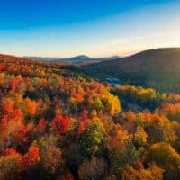 Aerial view of Mountain Forests with Brilliant Fall Colors in Autumn at Sunrise, Adirondacks, New York, New England