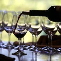 RUTHERFORD, CA - SEPTEMBER 20:  A worker at St. Supery winery pours a glass of wine for a tasting September 20, 2006 in Rutherford, California. Wineries in the Napa Valley region are in the midst of harvesting their 2006 crop and will pick and crush grapes until about mid-October.  (Photo by Justin Sullivan/Getty Images)