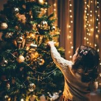 Little Girl Decorating Christmas Tree.