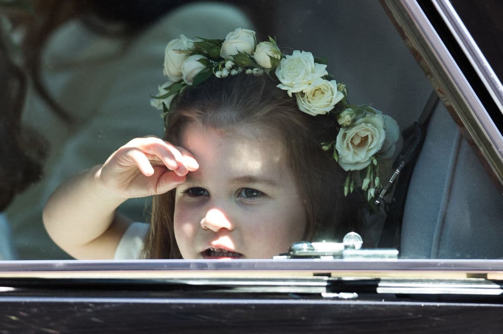 WINDSOR, ENGLAND - MAY 19:  Princess Charlotte of Cambridge attends the wedding of Prince Harry to Ms Meghan Markle at St George's Chapel, Windsor Castle on May 19, 2018 in Windsor, England. Prince Henry Charles Albert David of Wales marries Ms. Meghan Markle in a service at St George's Chapel inside the grounds of Windsor Castle. Among the guests were 2200 members of the public, the royal family and Ms. Markle's Mother Doria Ragland.  (Photo by Pool/Samir Hussein/WireImage)
