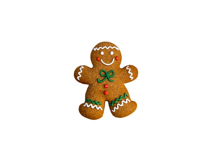Gingerbread woman cookie for Christmas against white background. Isolated on white. Handmade cakes by me.