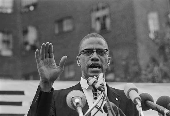 Nation of Islam leader Malcolm X draws various reactions from the audience as he restates his theme of complete separation of whites and African Americans. The rally outdrew a Mississippi-Alabama Southern Relief Committee civil rights event six blocks away 10 to 1.