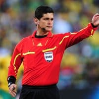 BLOEMFONTEIN, SOUTH AFRICA - JUNE 22:  Referee Oscar Ruiz officiates during the 2010 FIFA World Cup South Africa Group A match between France and South Africa at the Free State Stadium on June 22, 2010 in Mangaung/Bloemfontein, South Africa.  (Photo by Clive Mason/Getty Images)