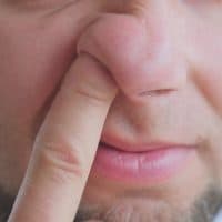 Adult Caucasian Male Picking Nose with Index Finger