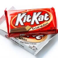 Miami, Florida, USA - April 10, 2014: Image of two packages of Kit Kat crisp waffers, one made with milk chocolate and the other one made with white cream, KitKat is made worldwide by Nestle and by The Hershey Company in the United States.