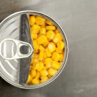 looking down on a tin of sweet corn