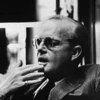American novelist, short story writer, and playwright Truman Capote (1924 - 1984) contemplatively touches his fingers to his chin during an interview at the Random House offices, New York, New York, April 10, 1969. During the interview Capote denied rumours that he had written a piece saying that former President John F. Kennedy was still alive. (Photo by William E. Sauro/New York Times Co./Getty Images)