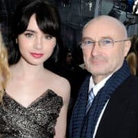 HOLLYWOOD, CA - MARCH 17:  Actress Lily Collins (L) and musician Phil Collins arrive at Relativity Media's "Mirror Mirror" Los Angeles premiere at Grauman's Chinese Theatre on March 17, 2012 in Hollywood, California.  (Photo by Frazer Harrison/Getty Images For Relativity Media)