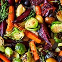 Full background of colorful roasted autumn vegetables, above view