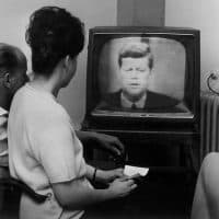 TV viewers in Stuttgart are watching the first live broadcast from the USA, which shows US President John F. Kennedy giving a speech, on 23 July 1962. The broadcast was enabled by the communication satellite Telstar, which was started on 10 July 1962 in Cape Canaveral. Telstar - or Telsat - is the first civil communication satellite and enables i. a. world wide television broadcasts. | usage worldwide (Photo by Harry Flesch/picture alliance via Getty Images)