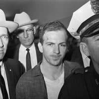 (Original Caption) Twenty-four-year-old ex-marine Lee Harvey Oswald is shown after his arrest here on November 22. He received a cut on his forehead and blackened left eye in scuffle with officers who arrested him. Oswald, an avowed Marxist, has been charged with the murder of President John F. Kennedy, who was killed by a sniper' bullet as he rode in motorcade through Dallas.