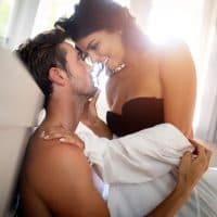 Beautiful young passionate couple  in bedroom